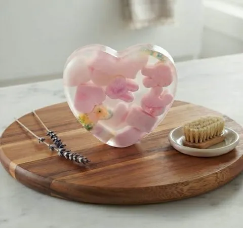 Pink Heart Resin Soap — Artisanal soap with encapsulated pink blossoms and botanicals.